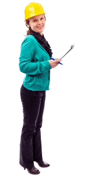 Young woman engineer with hardhat on her head holding pen and c — Stock Photo, Image