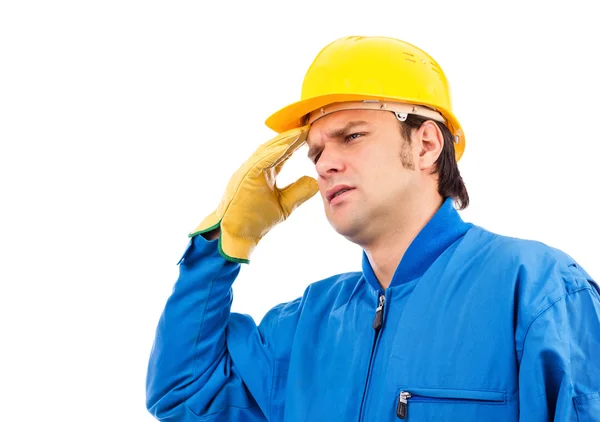 Joven trabajador de la construcción con dolor de cabeza —  Fotos de Stock