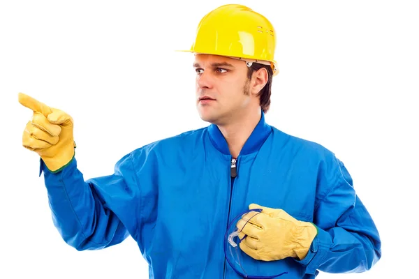 Retrato de un joven trabajador de la construcción señalando algo — Foto de Stock