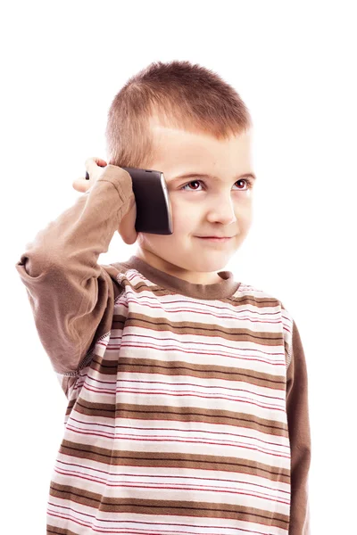 Bedårande liten pojke med mobiltelefon — Stockfoto