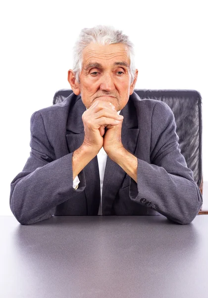 Portrait of a thoughtful elderly man holding his hands together — Stock Photo, Image