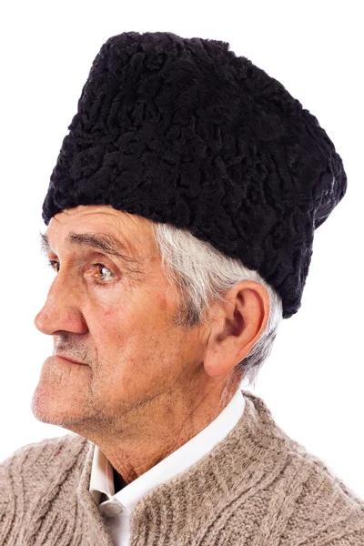 Portrait of a romanian old peasant with old fashion Astrakhan ha — Stock Photo, Image