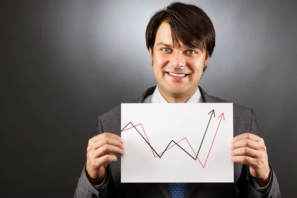 Businessman showing a rising graph, representing business growth