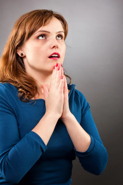 Closeup portrait of a young woman praying — Stock Photo, Image