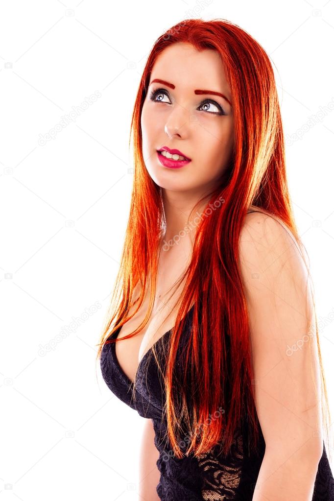 Closeup of beautiful redhead woman looking up