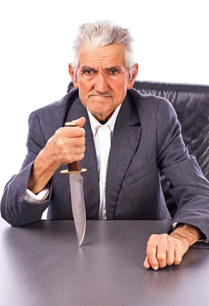 Furious senior with a knife looking at camera — Stock Photo, Image
