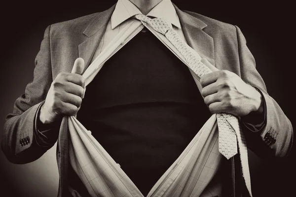 Conceptual image of a man tearing off his shirt — Stock Photo, Image