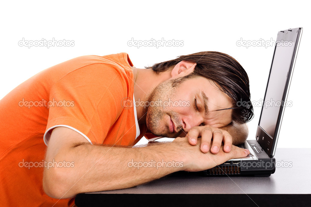 Young man taking a nap on his laptop