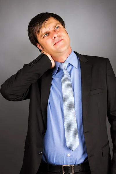 Portrait of a young businessman with neck pain — Stock Photo, Image