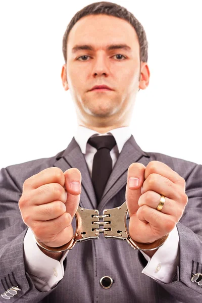 Closeup portrait of a young businessman with handcuffed hands — Stock Photo, Image