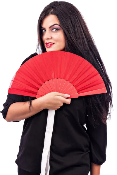 Portret van een brunette jonge vrouw met rode ventilator — Stockfoto