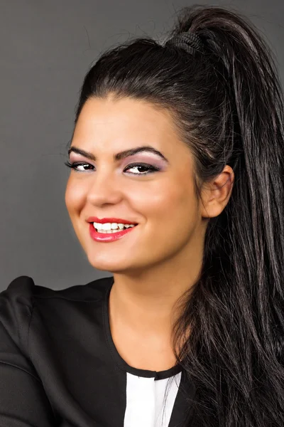 Closeup of a smiling caucasian brunette — Stock Photo, Image