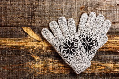 Grey knitted winter gloves clipart