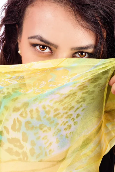 Beautiful young woman with a shawl partially covering her face — Stock Photo, Image