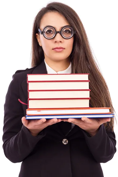 Portrait of a young serious teacher with glasses holding books — Stock Photo, Image