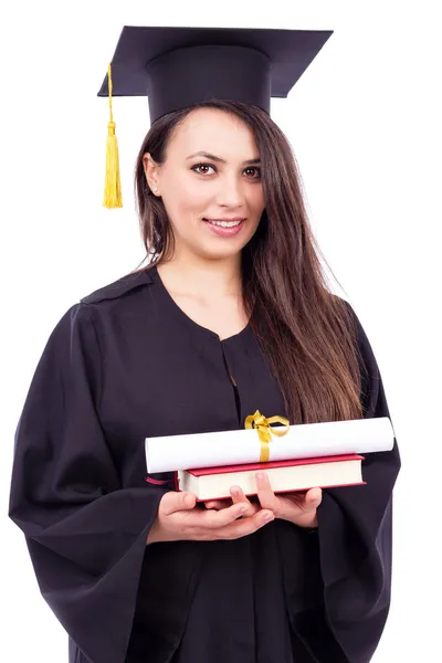 Bella studentessa donna in abito da laurea tenuta libro e tuffo — Foto Stock