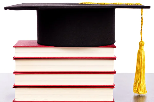 Graduation hat and books — Stock Photo, Image