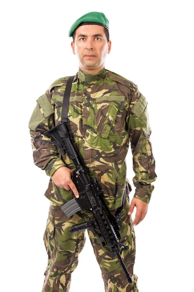 Portrait of a young soldier with a gun — Stock Photo, Image