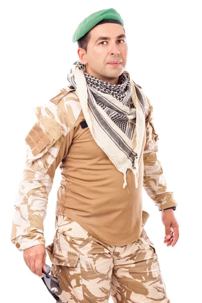 Young soldier with green beret and arabian scarf looking at came — Stock Photo, Image