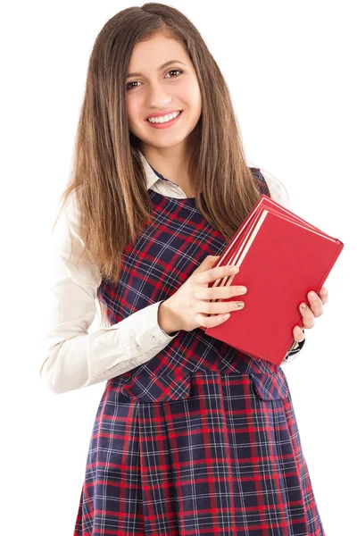 Feliz estudiante adorable sosteniendo una pila de libros — Foto de Stock