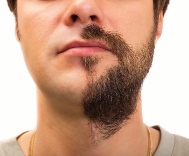 Suratının yarısı üzerinde sakallı closeup 