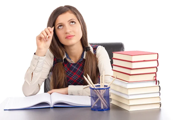 Studioaufnahme eines hübschen Schulmädchens, das eine schwere Entscheidung trifft — Stockfoto