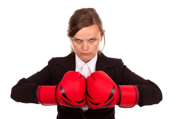 Angry businesswoman punching red boxing gloves together ready to — Stock Photo, Image