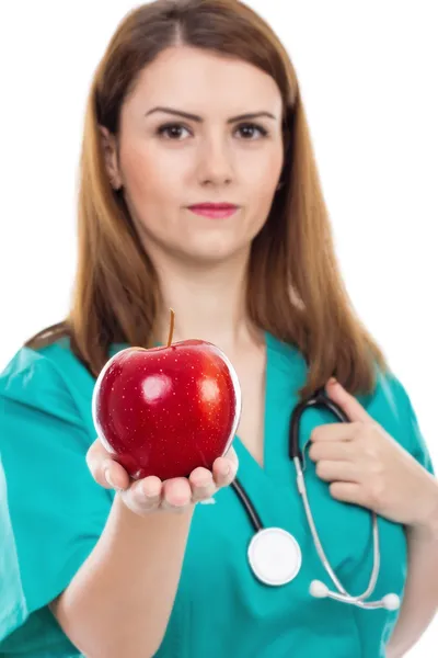 Female doctor giving apple ,concept for healthy lifestyle, — Stock Photo, Image