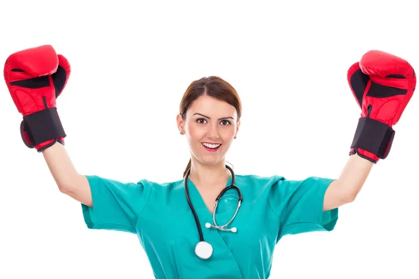 Happy young female doctor or nurse wearing  boxing gloves — Stock Photo, Image