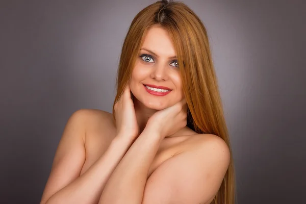 Studio shot of sexy young woman with long blonde hair — Stock Photo, Image