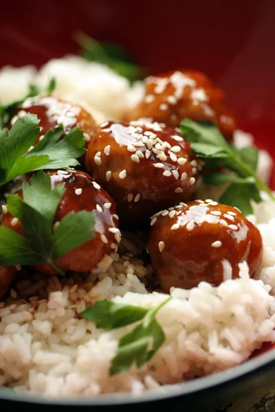Asian meatballs on rice Stock Photo
