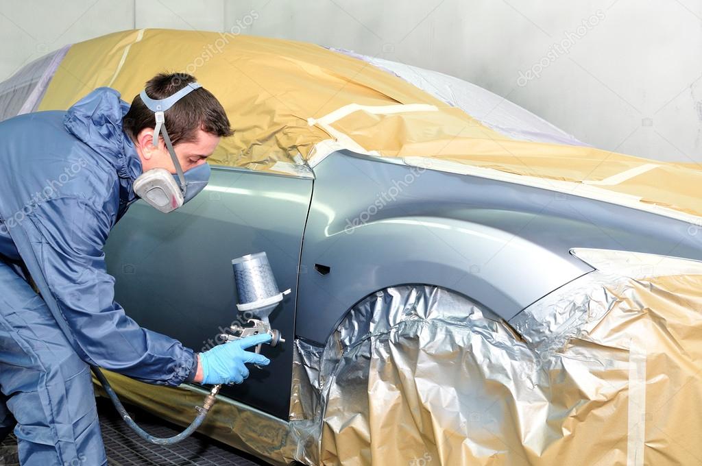 Worker painting a car. — Stock Photo © lorakss 19441441