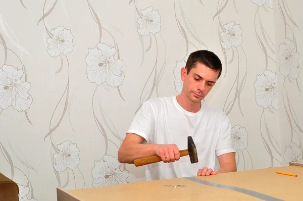 Family man assembling furniture. — Stock Photo, Image