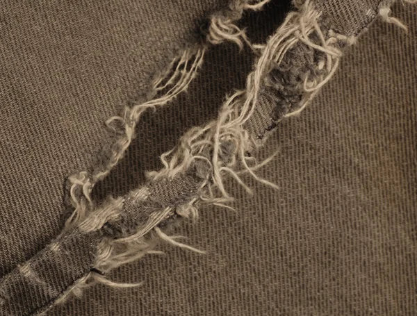 Makro eines ausgefransten Hosenbeins auf schwarzen Jeans — Stockfoto