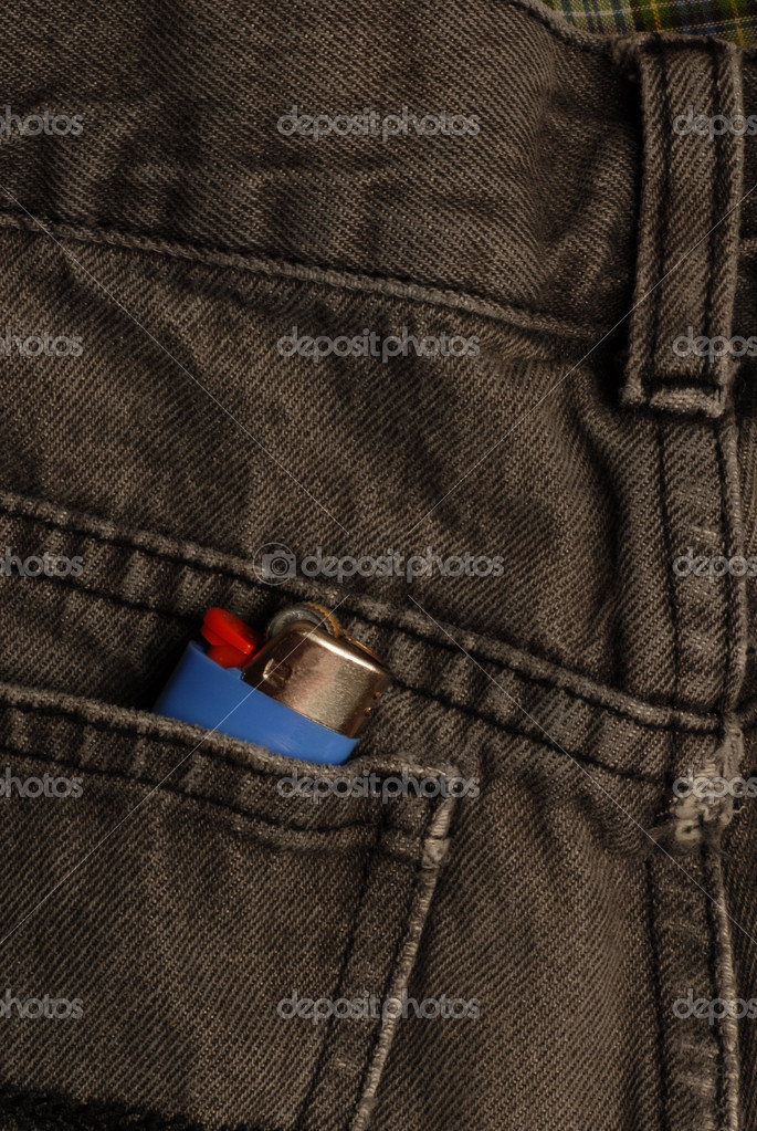 Black blue jeans with lighter in the back pocket Stock Photo by