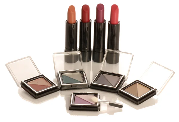Collection of lipsticks and eyeshadows — Stock Photo, Image