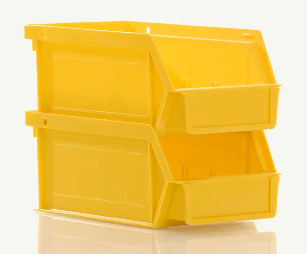 Två staplade gula delar bin — Stockfoto
