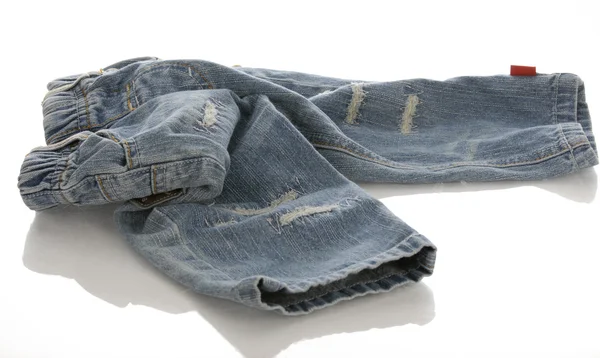 Infant or baby denim jeans in a pile — Stock Photo, Image