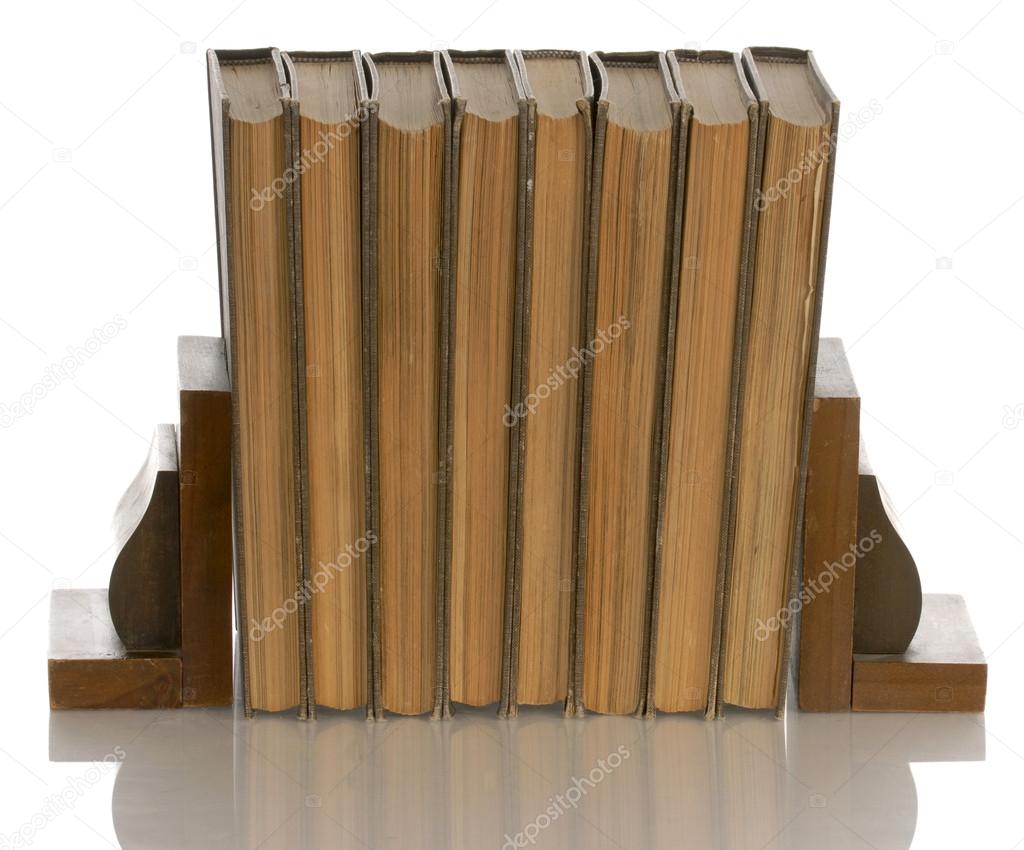 old books held up with wooden bookends