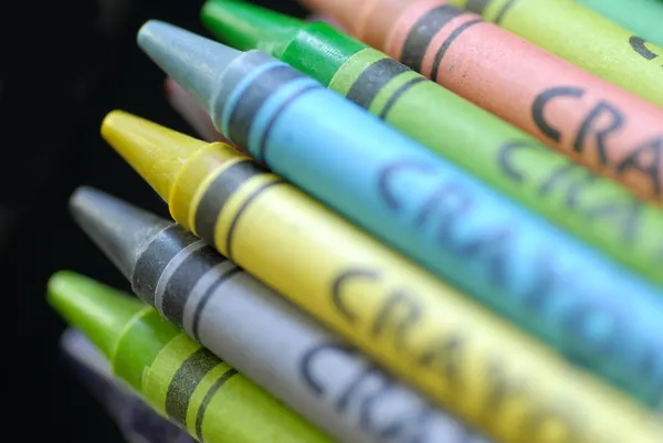 Childrens colorful wax crayons on black background — Stock Photo, Image