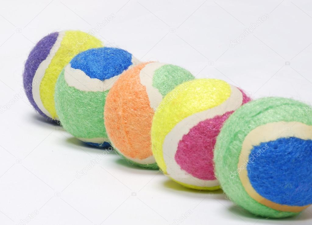 multi colored tennis balls - concept on multi-culturalism