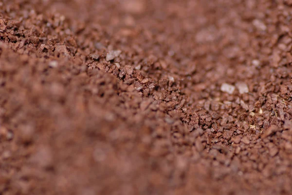 Ground coffee bean background with very shallow and selective depth of field — Stock Photo, Image