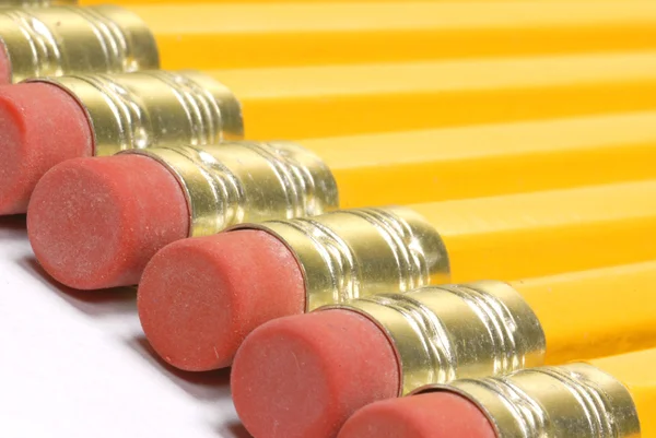 Several pencils lined up with the eraser end on pencil showing — Stock Photo, Image