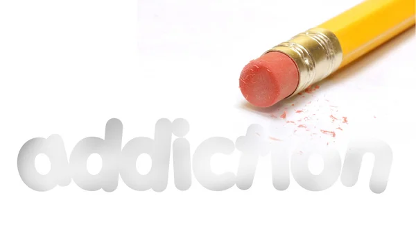 The word addiction being erased by the end of a pencil — Stock Photo, Image