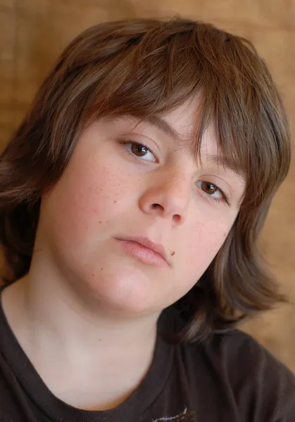 Bored young 12 year old with unhappy expression — Stock Photo, Image