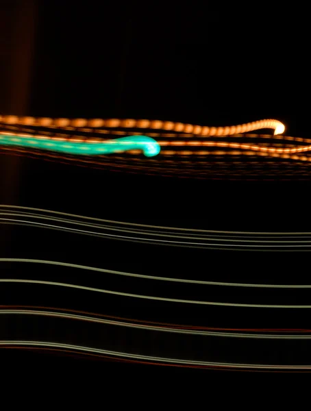 Racing oranje en groen licht abstract stroomt — Stockfoto