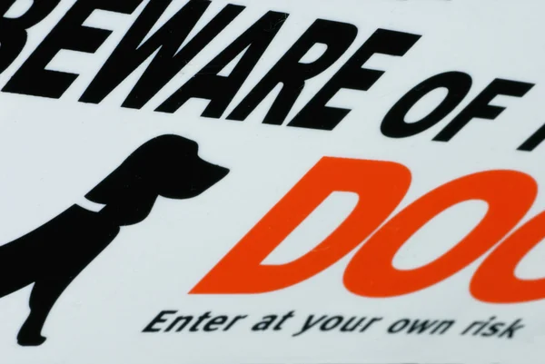 Beware of dog warning - enter at own risk — Stock Photo, Image