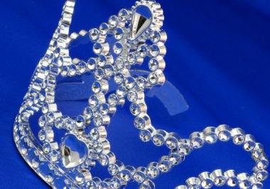 tiara or crown details on blue background clipart