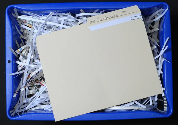 File with business contracts in blue recycling bin — Stock Photo, Image