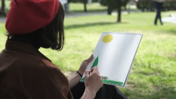 Image Painting Drawn Canvas Green Park Woman Red Hat Painting — Stock Video